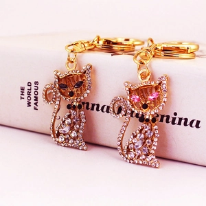 Porte-clés Chat Étincelant en Strass Pendentif Animal en Alliage Plaqué Or Charme de Sac pour Femme Accessoires
