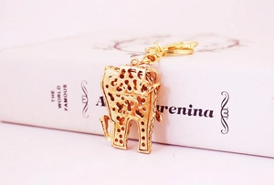 Detailed view of golden elephant keychain with sparkling rhinestones and lobster clasp