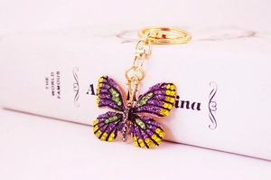 Detail shot of colorful rhinestone butterfly keychain with gold lobster clasp and ring