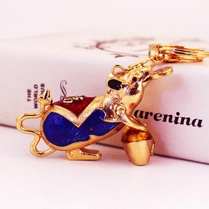 Cute golden mouse keychain with colorful rhinestones and traditional fortune elements