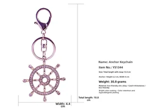 Détails du porte-clés gouvernail rose doré orné de strass roses et émail brillant