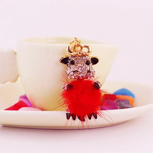 Cute ox keychain with red faux fur ball and sparkling rhinestones for handbags