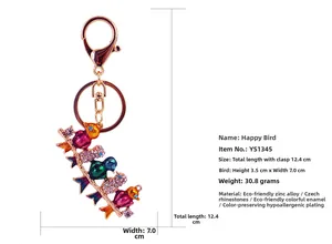 Detail view of the colorful rhinestone bird keychain showing size dimensions and materials
