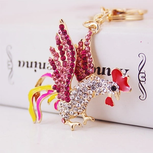 Sparkling gold rooster keychain with colorful rhinestones and red enamel details