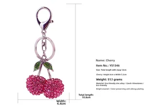 Detail view of pink rhinestone cherry keychain with dimensions and green leaves