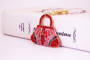 Detail of rhinestone handbag keychain with red and white crystals and gold hook