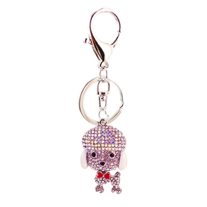 Sparkling crystal poodle puppy keychain with rhinestones and a red bow on silver base