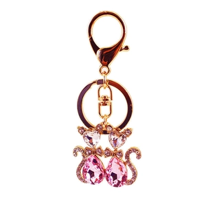 Süßer goldener Katzen-Schlüsselanhänger mit rosa und weißen Kristallen für Taschen