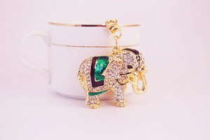 Detailed macro view of an elephant keychain featuring gold alloy and sparkling rhinestones