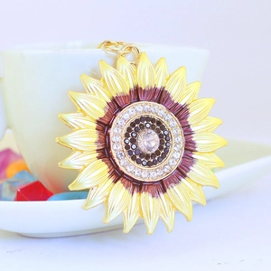 Golden sunflower keychain featuring colorful petals and rhinestone crystal details