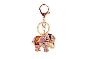 Detail view of the golden elephant keychain with sparkling white rhinestones and lobster clasp