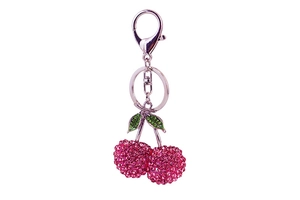 Close-up of pink and green rhinestone cherry keychain with silver alloy lobster clasp