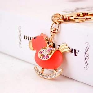 Cute coral orange chick keychain with sparkling crystals and golden metal ring