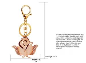 Detail showing pink cat eye stone rose keychain with crystal rhinestones and measurements
