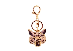 Detail of tiger head keychain featuring sparkling white rhinestones and black enamel accents