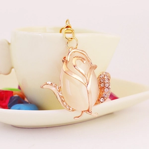 Elegant rose keychain with opal cat eye stone and rhinestones on gold metal frame