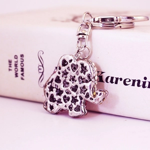 Cute pink elephant keychain with hollow heart design and sparkling white crystals