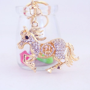 Porte-clés cheval en cristal scintillant, métal doré avec motif de pièce porte-bonheur