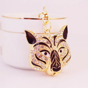 Sparkling rhinestone tiger head keychain in gold alloy finish with decorative lobster clasp