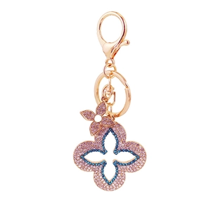 Funkelnder Kleeblatt-Schlüsselanhänger mit rosa und blauen Kristallen und Karabiner