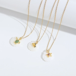 Gouden kettingset met zeeschildpad, krab en zeester hangers en zirkonia accenten