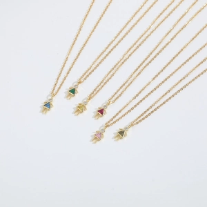 Set of six gold necklaces with colorful zircon girl pendants in assorted bright colors