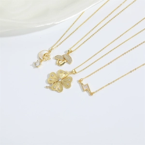 Elegant 14k gold plated necklaces featuring star, moon, mushroom and clover pendants