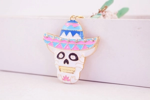 Detailed macro view of colorful rhinestone skull keychain with Mexican hat and enamel work