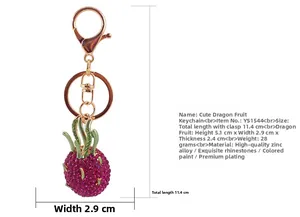 Detail view of rhinestone dragon fruit keychain showing dimensions of 11.4cm total length