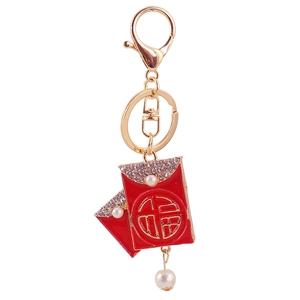 Detail of red envelope charms with gold Fu character, rhinestones and white pearls keychain