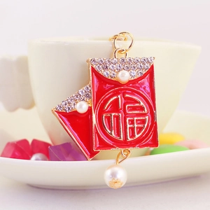 Chinese style Fu charm keychain with red enamel, faux pearls and sparkling rhinestones
