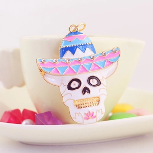 Colorful sombrero skull keychain with white enamel, rhinestones and golden metal finish