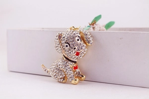 Close-up of cute puppy keychain with sparkling white rhinestones and red heart detail