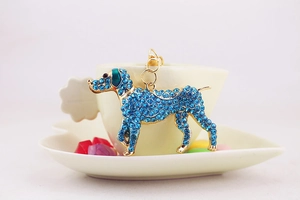 Detailed macro shot of blue rhinestone puppy dog keychain with gold-plated alloy lobster clasp