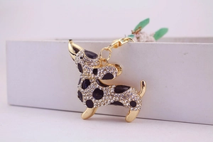 Detail of dachshund keychain with sparkling rhinestones and golden metal lobster clasp