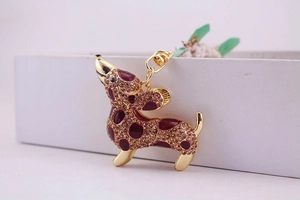 Macro shot of a rhinestone dachshund keychain with gold-plated alloy lobster clasp