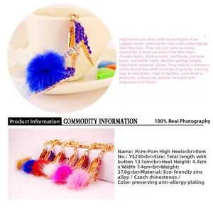 Detail view of rhinestone high heel keychain with dimensions and colorful fur pom poms