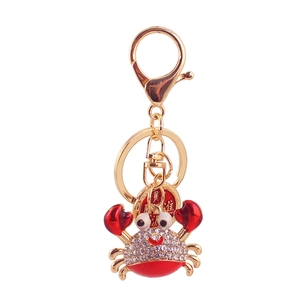 Cute crab keychain with red enamel, gold frame and white crystal rhinestones
