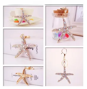 Starfish keychain detail with colorful crystals, golden alloy base and lobster clasp