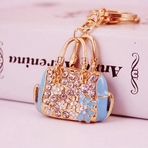 Sky blue handbag shaped keychain with gold plating and sparkling crystal rhinestones