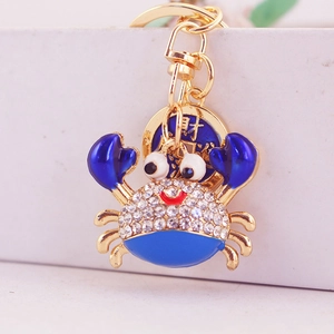 Cute golden crab keychain with blue enamel and sparkling rhinestones for women