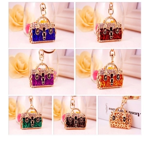 Collection of colorful leopard print handbag keychains with crystals and gold clasps