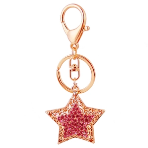 Cute golden star keychain for women with pink rhinestones and hollow metal craft