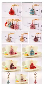 Detail of colorful crystal perfume bottle keychains with gold parfum labels