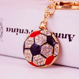 Golden soccer ball keychain with sparkling white rhinestones and colorful enamel