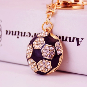 Sparkling soccer keychain with gold plating, black enamel and white crystal rhinestones