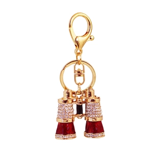 Portachiavi creativo a cannocchiale dorato con strass brillanti e smalto rosso