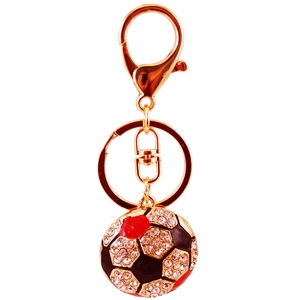 Sparkling soccer keychain with red and black crystals on a golden metal ring