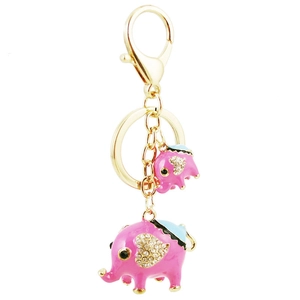 Porte-clés éléphant doré avec émail rose et bleu et breloques en strass brillants