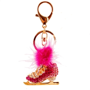 Pink rhinestone roller skate keychain with fluffy fur pompom and golden alloy frame